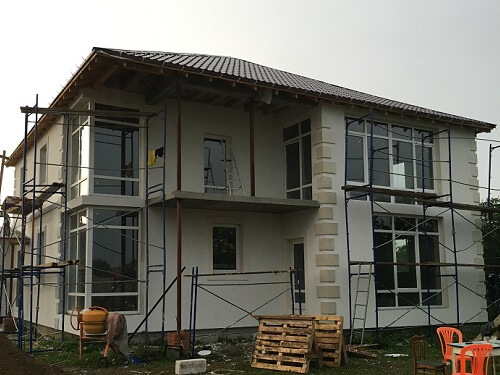 Отделка фасада дома штукатуркой в Ошмянах